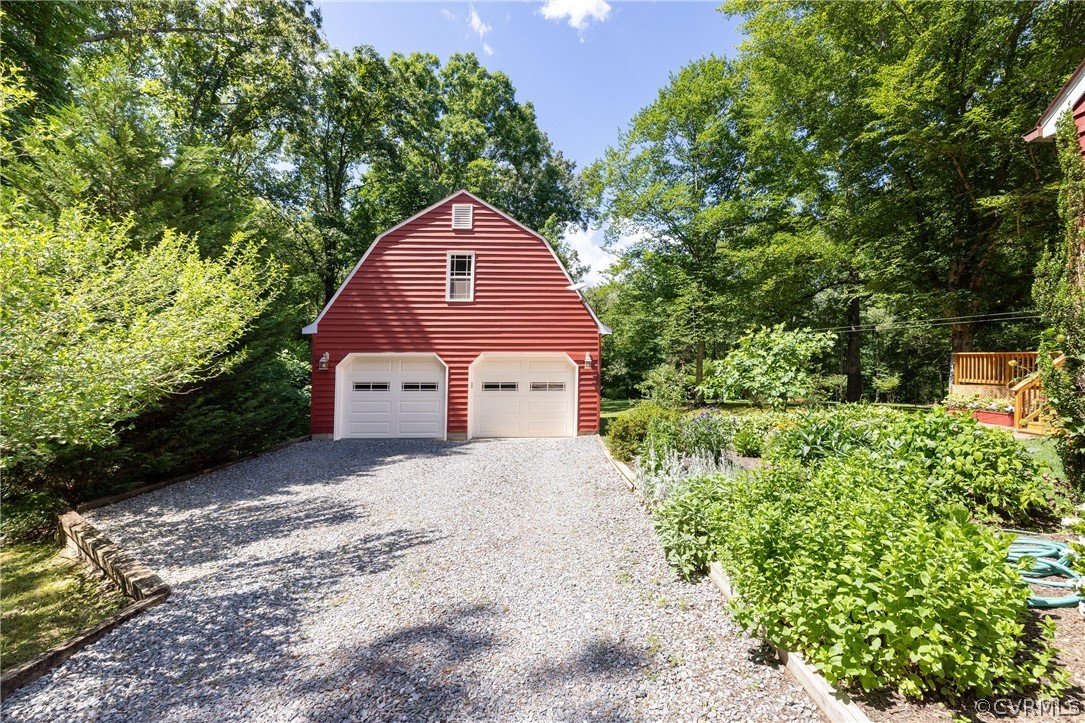 5421 Hunters Trail Road Goochland, VA 23063 - Photo 48 of 50 a front view of a house with a yard and garage