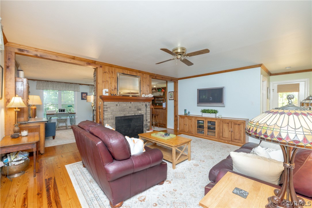 5421 Hunters Trail Road Goochland, VA 23063 - Photo 9 of 50 a living room with furniture a fireplace and a flat screen tv