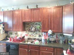 881 Middle River Road Baltimore, MD 21220 - Photo 3 of 3 a kitchen with a sink and cabinets