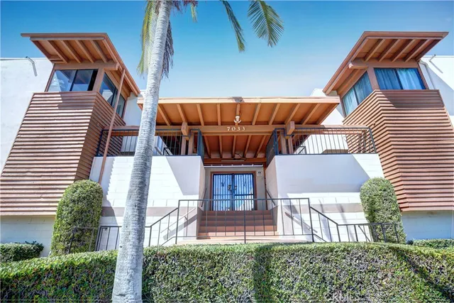 a view of backyard of house with seating space