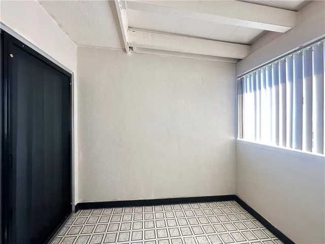 a view of an empty room and window