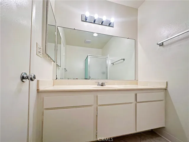 a bathroom with a sink and mirror