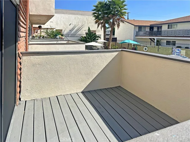 a view of balcony with wooden floor