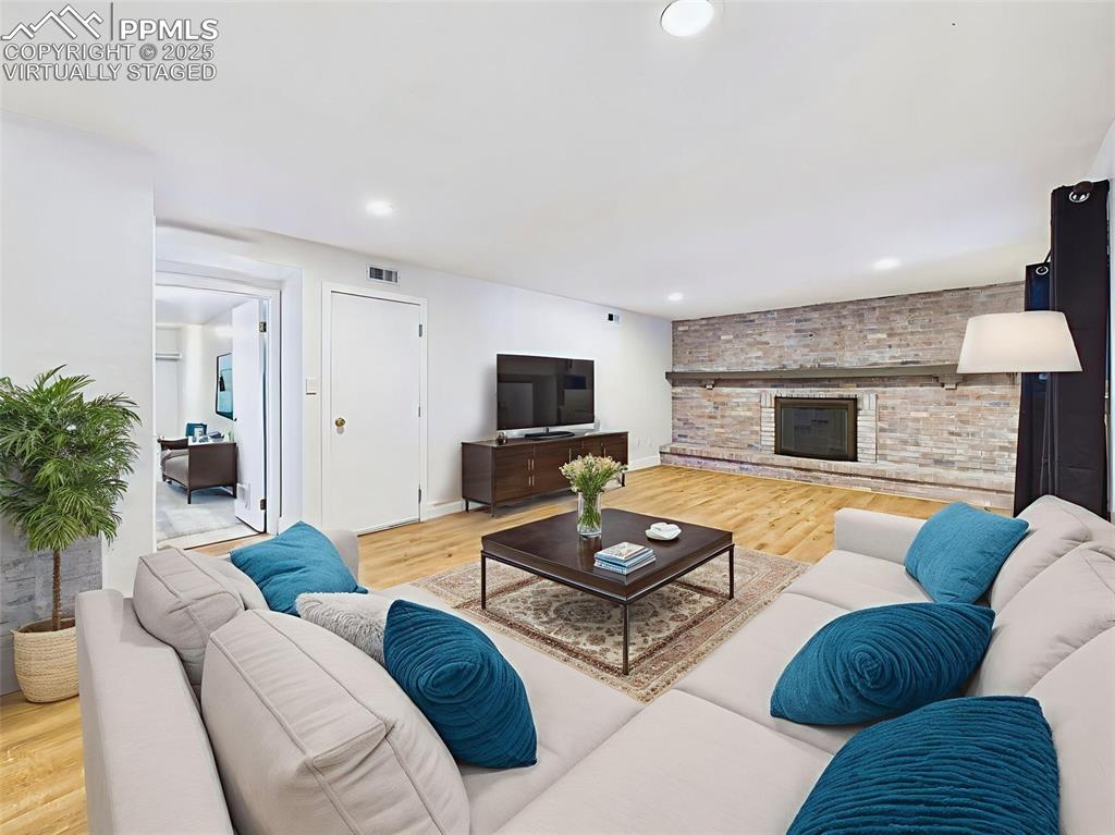 5040 Escapardo Way Colorado Springs, CO 80917 - Photo 19 of 50 a living room with furniture and a fireplace