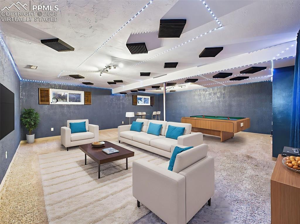 5040 Escapardo Way Colorado Springs, CO 80917 - Photo 23 of 50 a living room with furniture and a large window