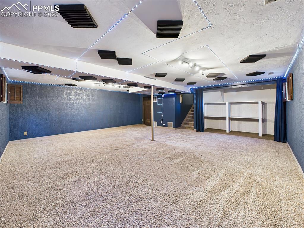 5040 Escapardo Way Colorado Springs, CO 80917 - Photo 24 of 50 a view of an empty room with a ceiling fan