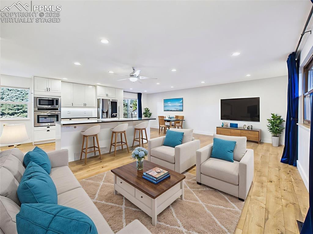 5040 Escapardo Way Colorado Springs, CO 80917 - Photo 4 of 50 a living room with furniture and a flat screen tv