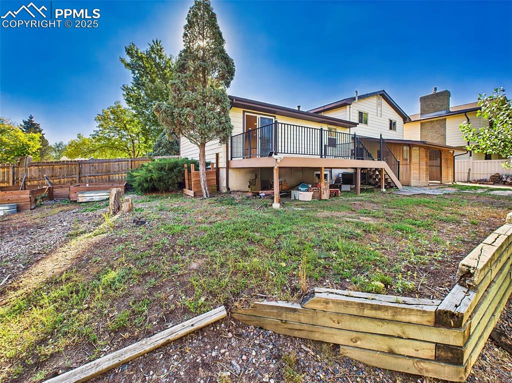 5040 Escapardo Way Colorado Springs, CO 80917 - Photo 43 of 50 a view of a house with a yard