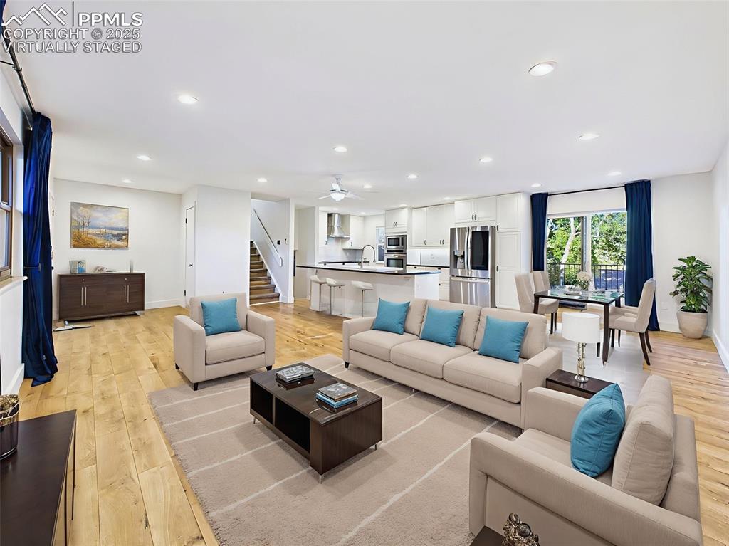 5040 Escapardo Way Colorado Springs, CO 80917 - Photo 6 of 50 a living room with furniture and a view of kitchen