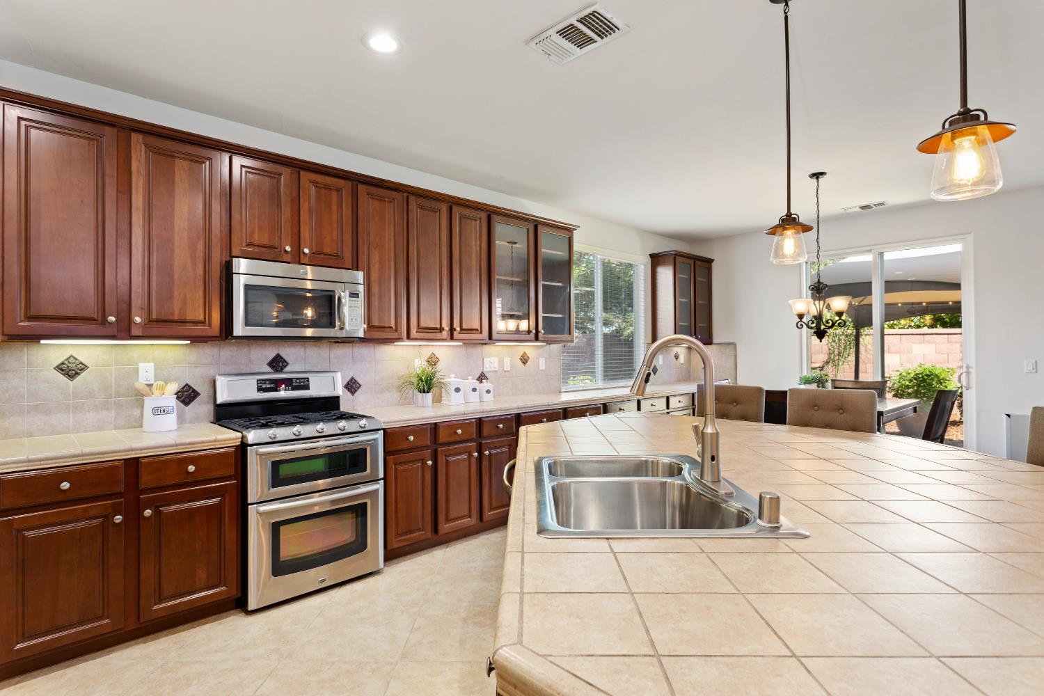 12088 Runswick Court Rancho Cordova, CA 95742 - Photo 20 of 54 Plentiful cabinets, Microwave, and Stove!