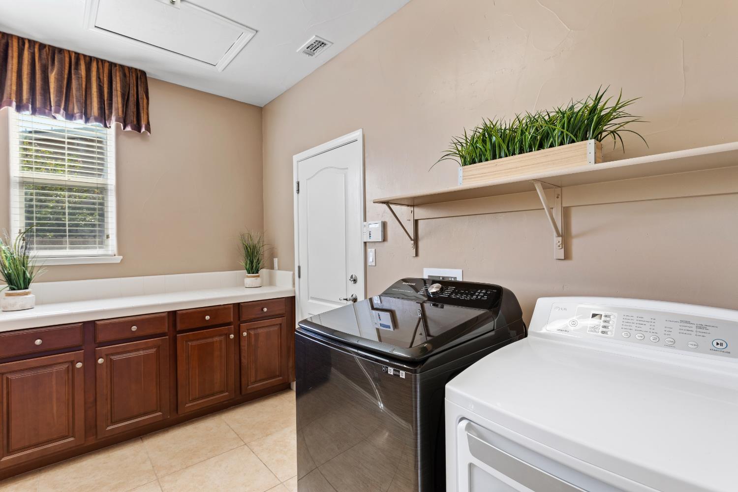 12088 Runswick Court Rancho Cordova, CA 95742 - Photo 28 of 54 Laundry Room with cabinets!