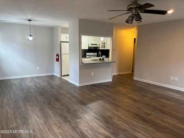 a view of a kitchen from the hallway