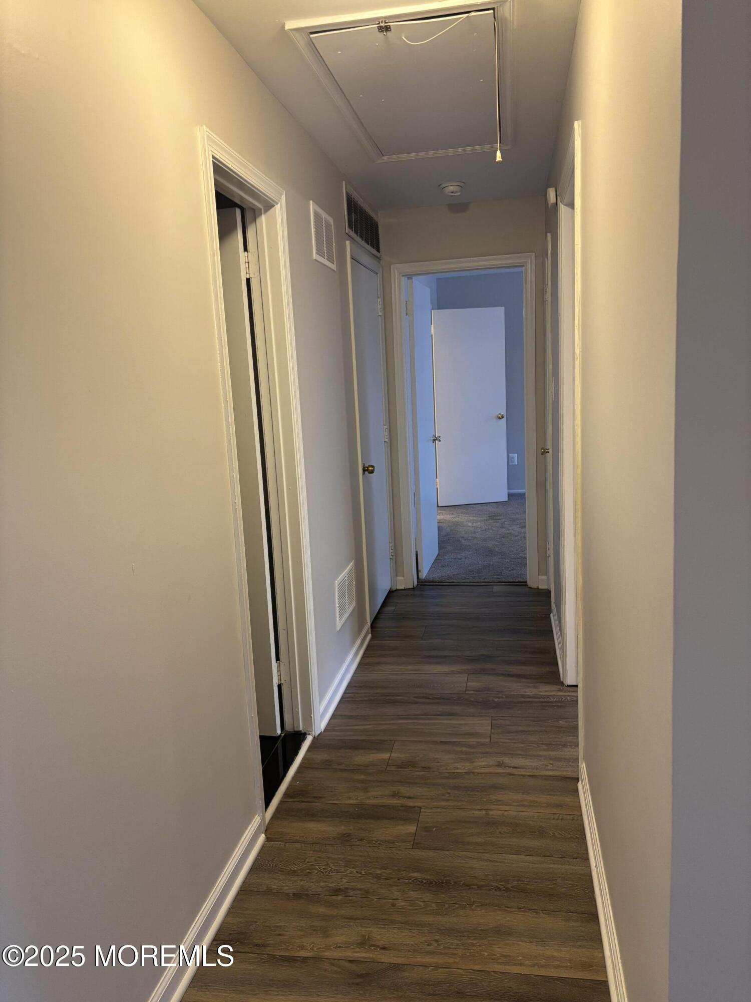 481 Hawthorne Place Morganville, NJ 07751 - Photo 22 of 36 a view of a hallway with wooden floor