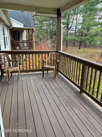 a view of balcony with furniture