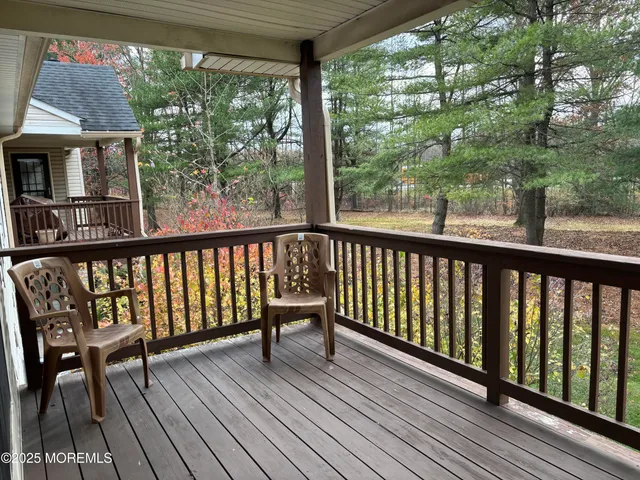 a view of balcony with wooden floor and outdoor space