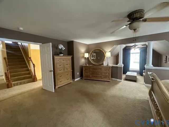 a bathroom with a tub a sink and mirror