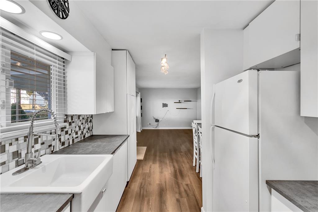 734 Jefferson Road Pittsburgh, PA 15235 - Photo 12 of 29 a kitchen with granite countertop a refrigerator and a sink