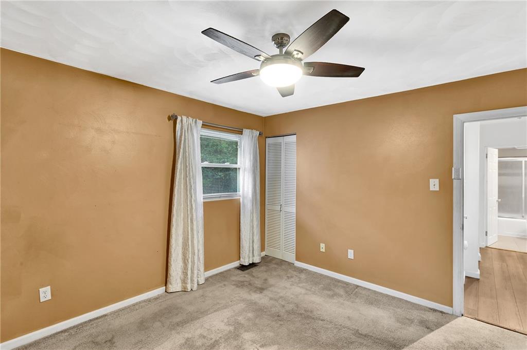 734 Jefferson Road Pittsburgh, PA 15235 - Photo 15 of 29 an empty room with ceiling fan and windows