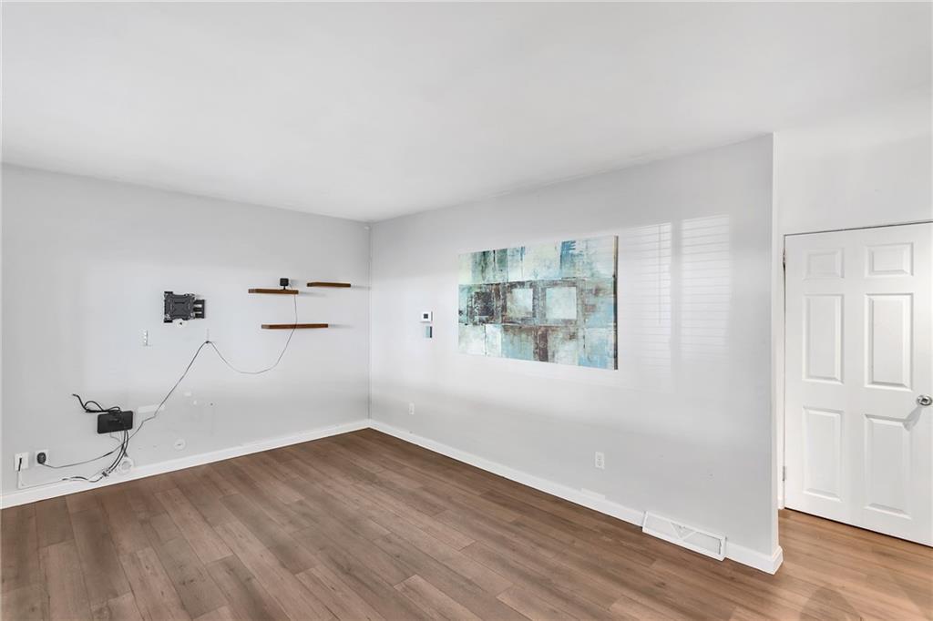 734 Jefferson Road Pittsburgh, PA 15235 - Photo 5 of 29 an empty room with wooden floor and windows