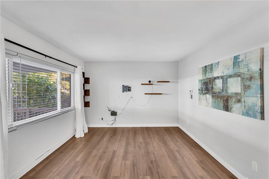 734 Jefferson Road Pittsburgh, PA 15235 - Photo 6 of 29 wooden floor in an empty room with a window