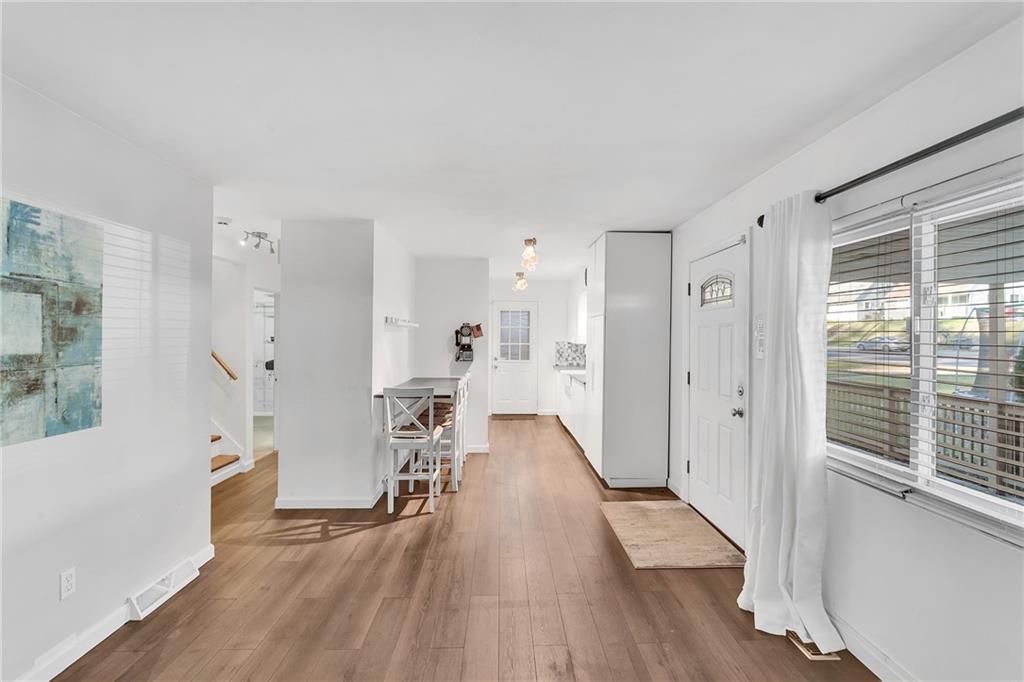 734 Jefferson Road Pittsburgh, PA 15235 - Photo 7 of 29 a view of empty room with wooden floor and windows