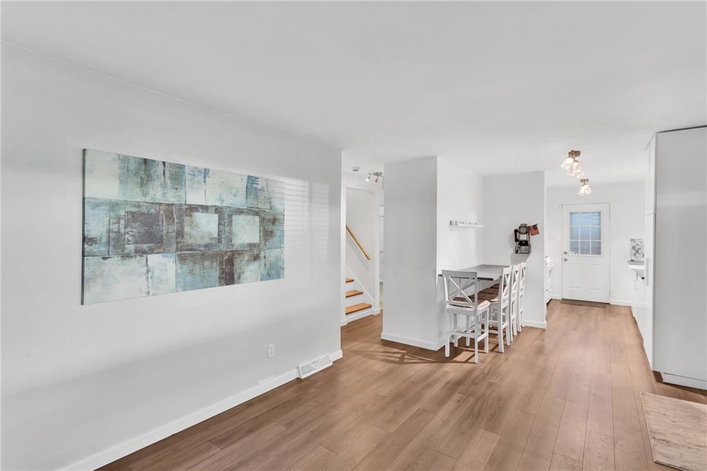 734 Jefferson Road Pittsburgh, PA 15235 - Photo 9 of 29 a living room with furniture and a table with wooden floor