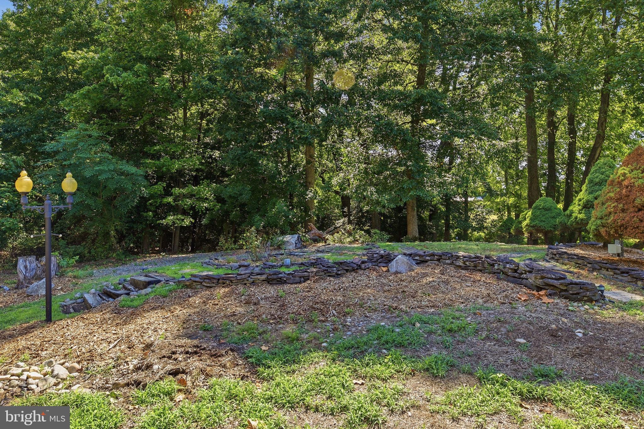 4150 Williams Wharf Road St. Leonard, MD 20685 - Photo 50 of 70 Serene garden retreat in nature's embrace.