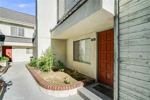 a view of house with backyard porch and outdoor seating