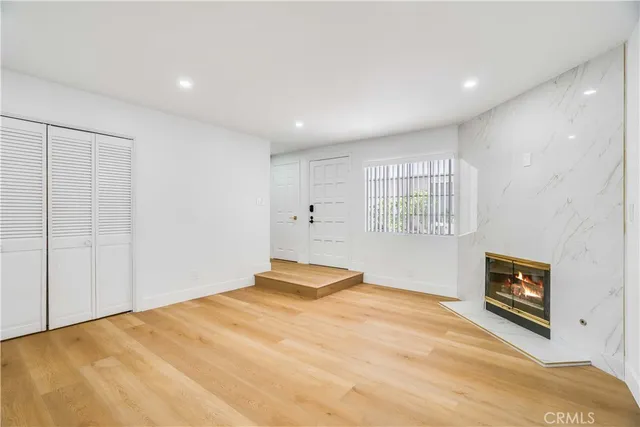 a bedroom with a bed and a tv