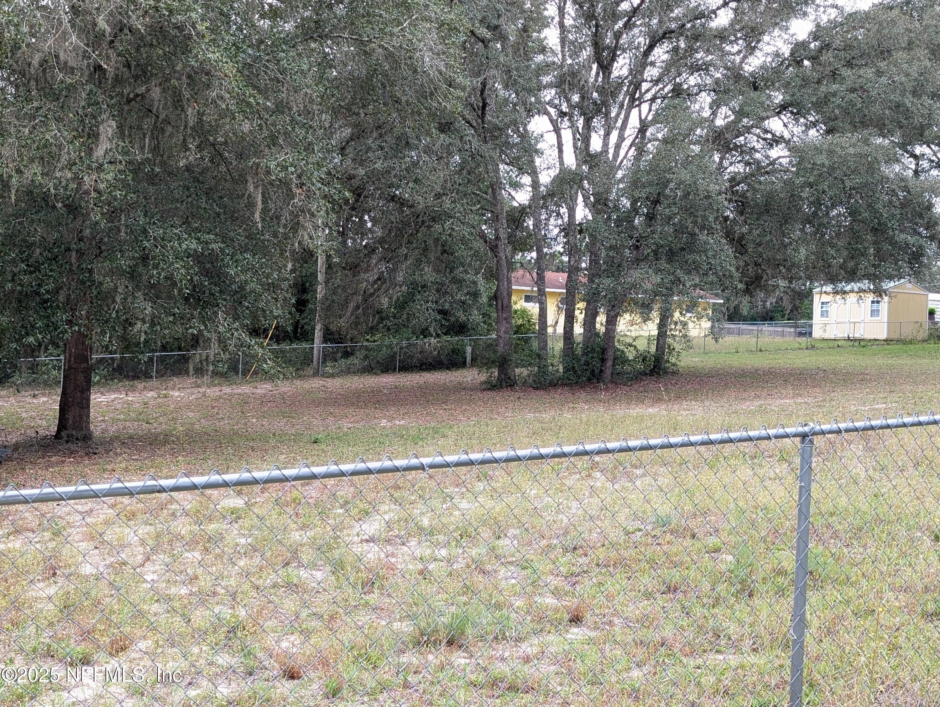 211 1st Way Interlachen, FL 32148 - Photo 3 of 5 a view of a yard with a trees
