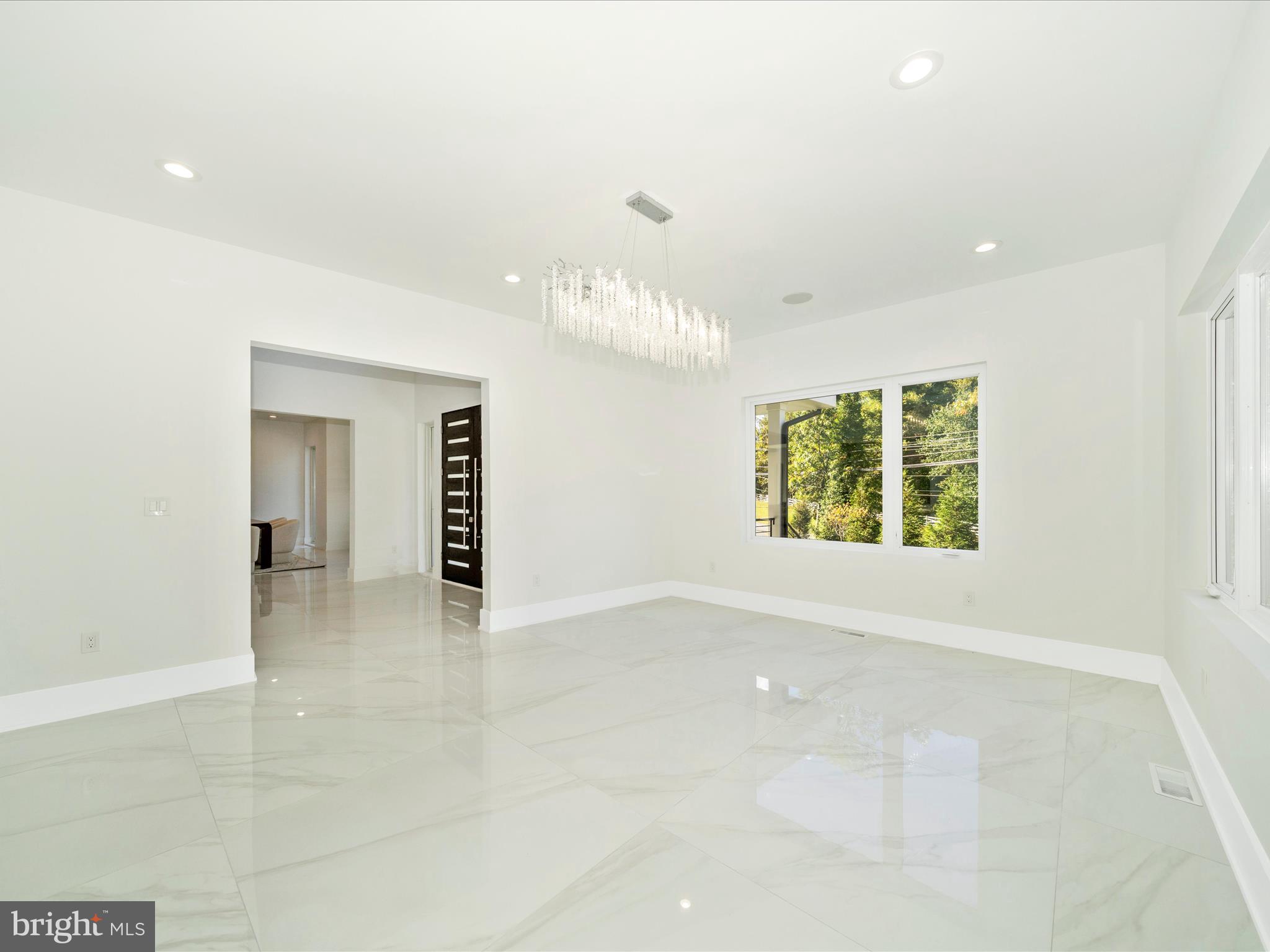 2209 Hunter Mill Road Vienna, VA 22181 - Photo 14 of 102 an empty room with windows and entrance