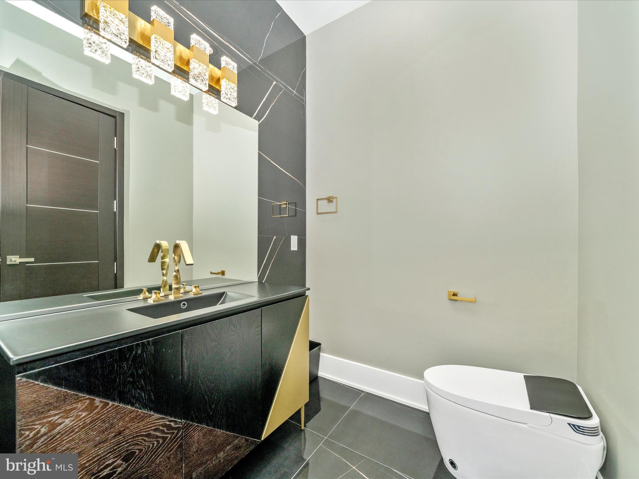 2209 Hunter Mill Road Vienna, VA 22181 - Photo 15 of 102 a bathroom with a sink a toilet and mirror