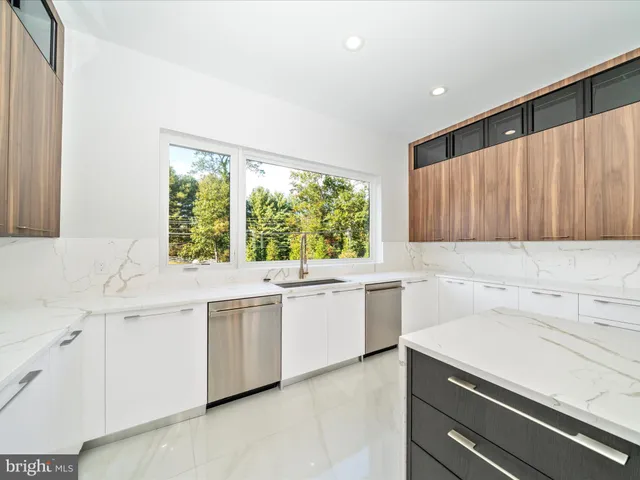 a view of a room with a large window and an outdoor view