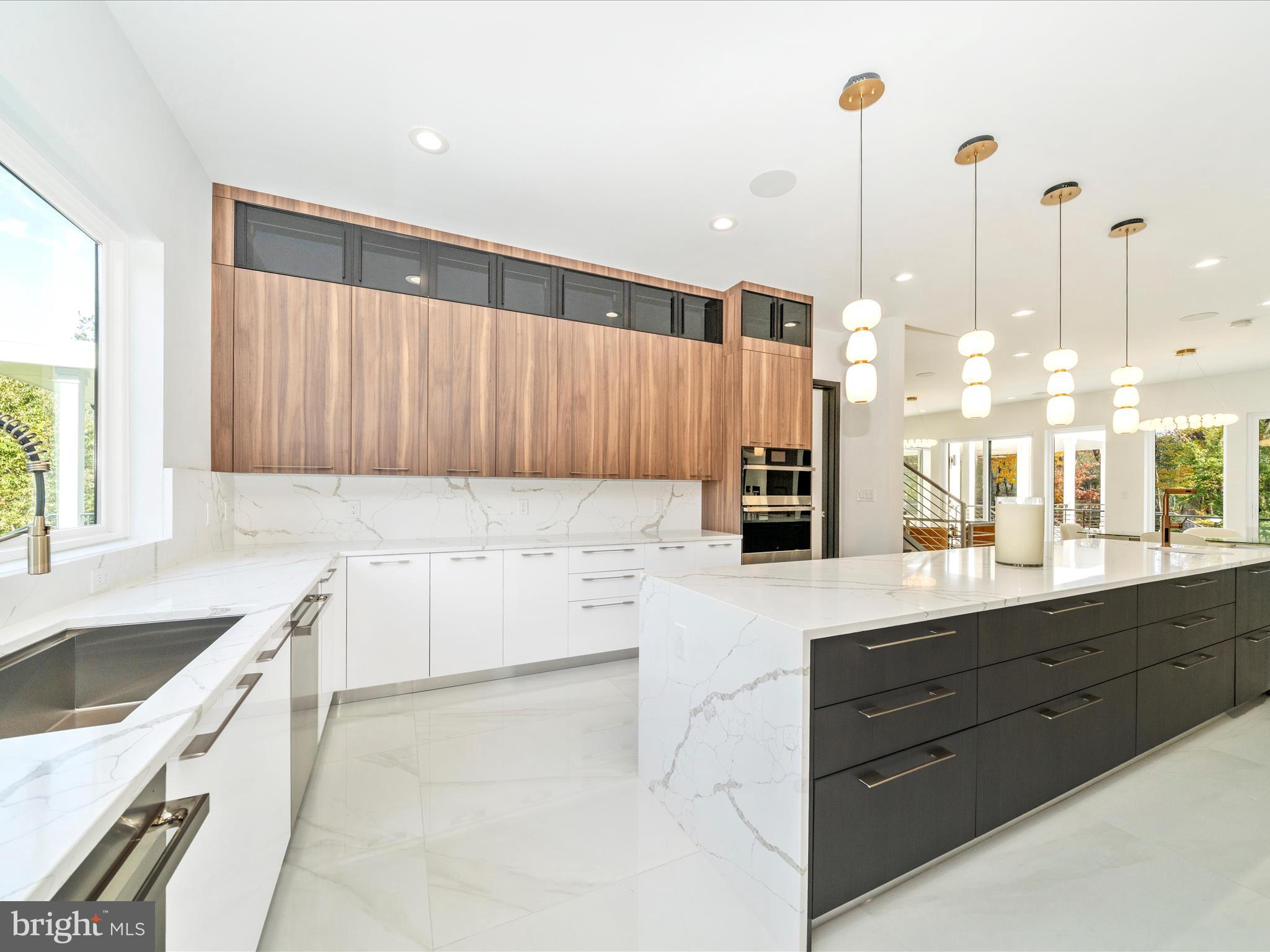 2209 Hunter Mill Road Vienna, VA 22181 - Photo 25 of 102 a kitchen with a sink and a stove top oven