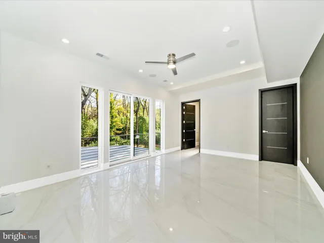 a kitchen with a table and chairs in it