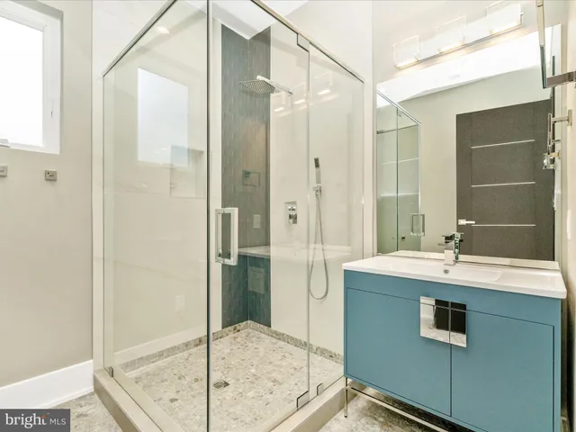 an empty room with closet and windows