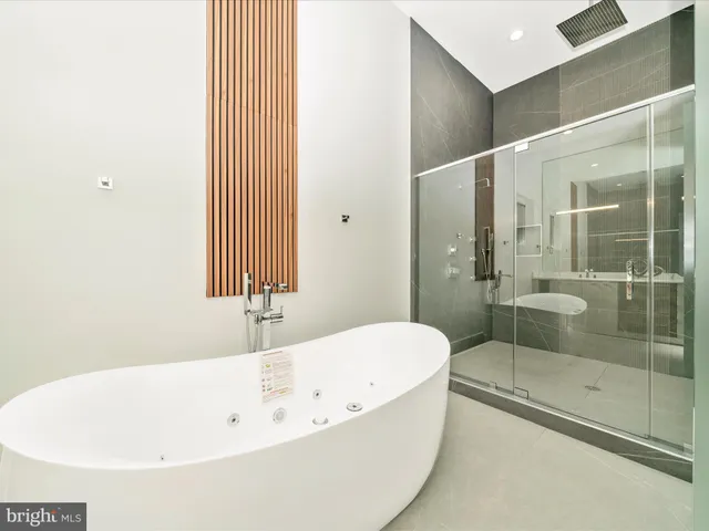 a view of a big house with a big yard and large trees