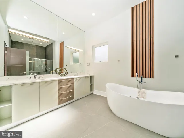 a view of a house with a big yard and potted plants