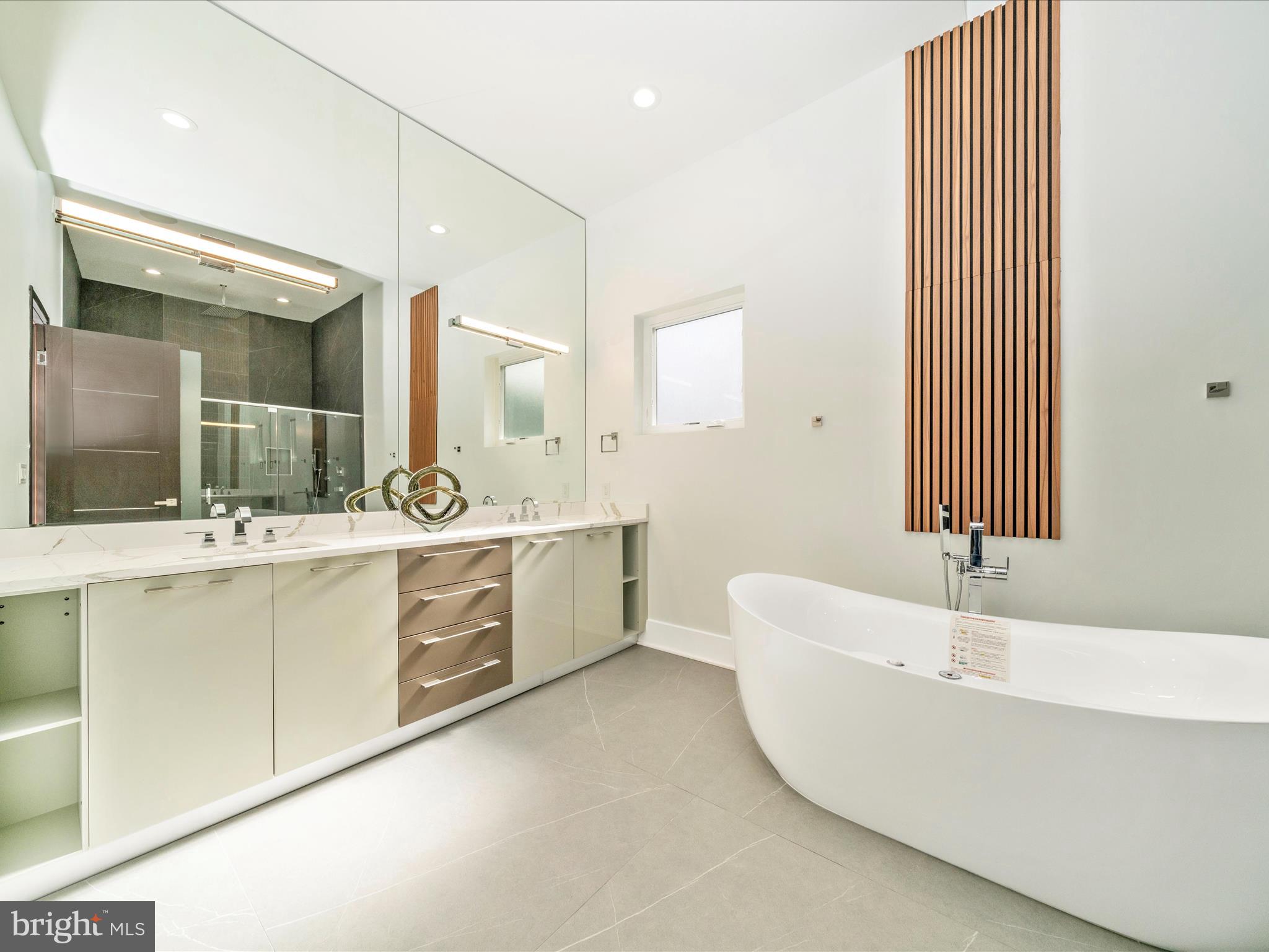 2209 Hunter Mill Road Vienna, VA 22181 - Photo 48 of 102 a bathroom with a double vanity sink mirror and bathtub