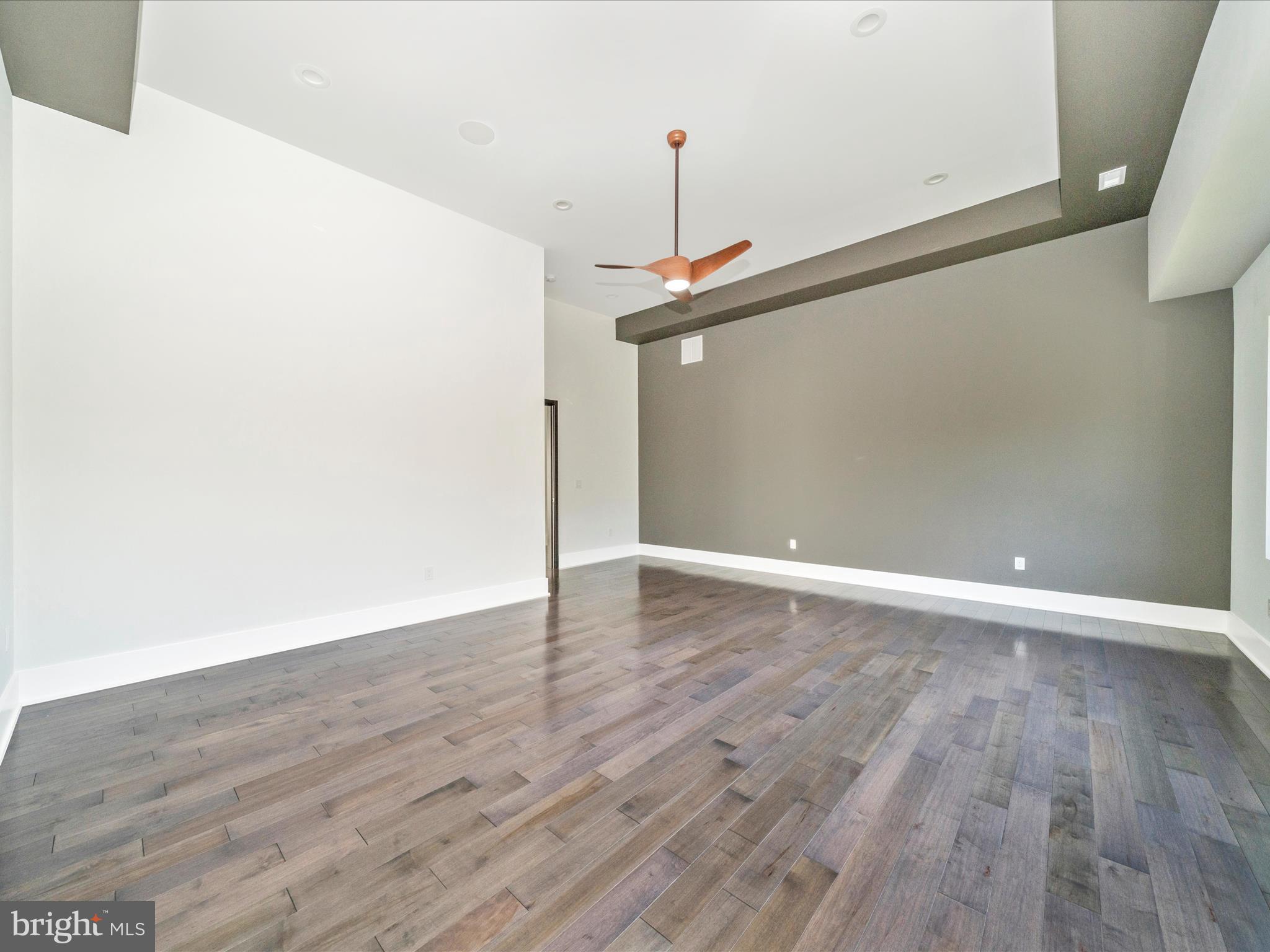 2209 Hunter Mill Road Vienna, VA 22181 - Photo 55 of 102 a view of an empty room with wooden floor