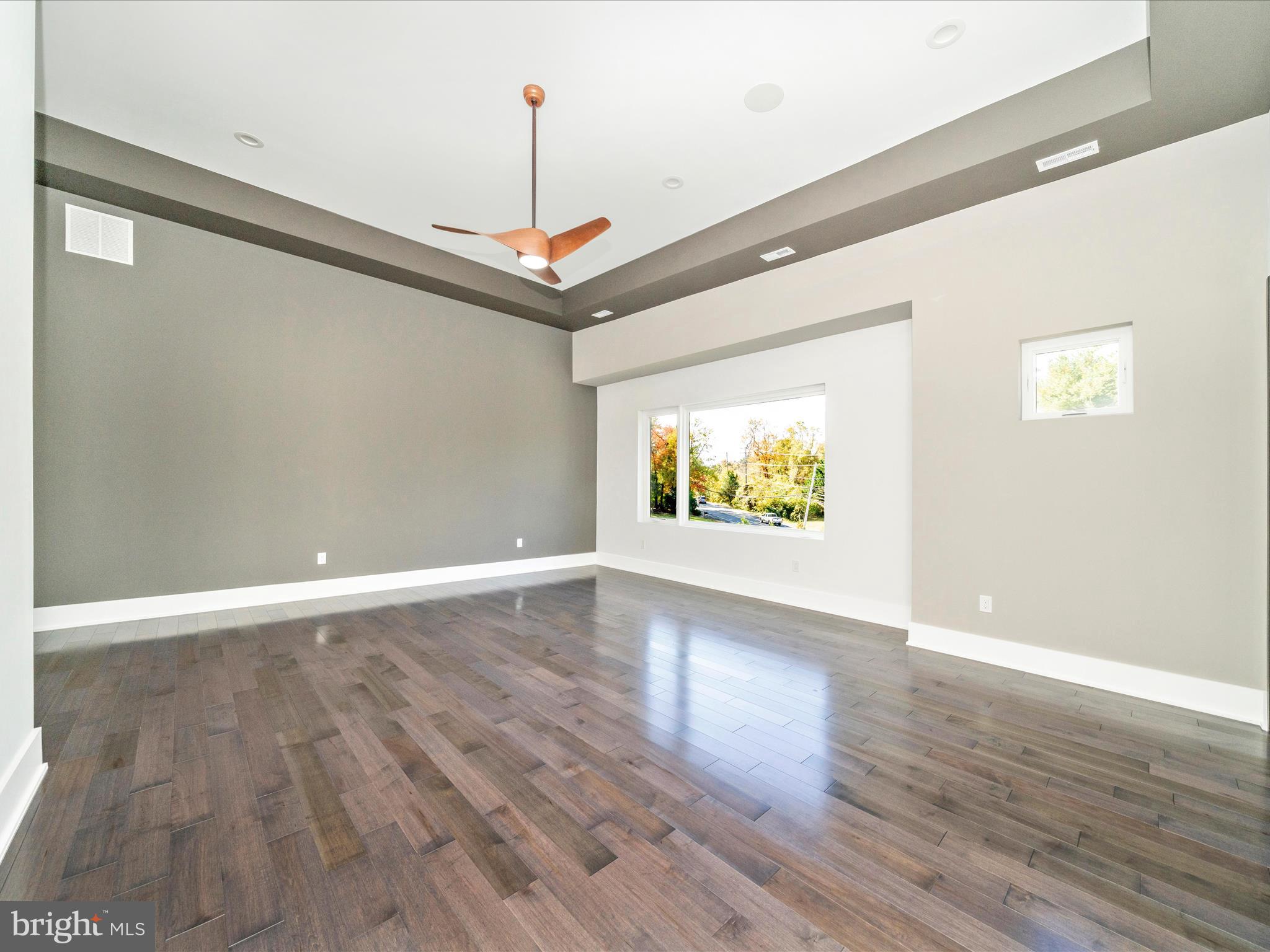 2209 Hunter Mill Road Vienna, VA 22181 - Photo 56 of 102 a view of an empty room with wooden floor