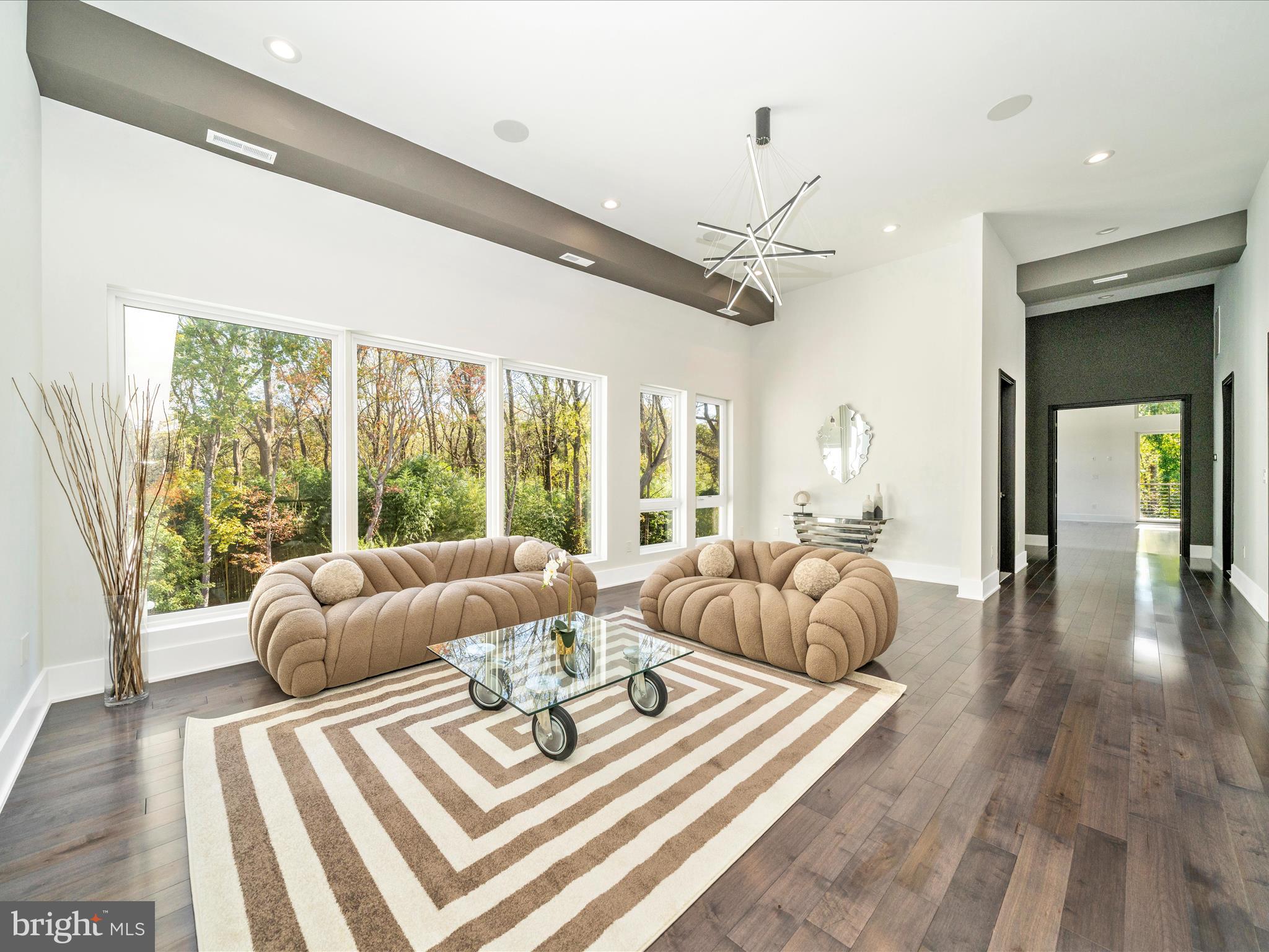 2209 Hunter Mill Road Vienna, VA 22181 - Photo 64 of 102 a living room with furniture and a large window