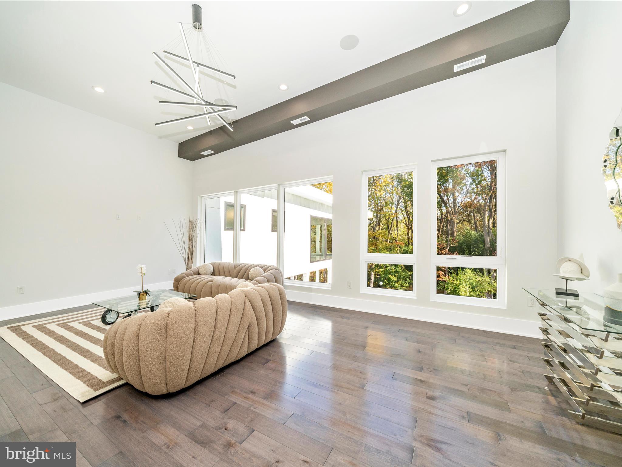 2209 Hunter Mill Road Vienna, VA 22181 - Photo 65 of 102 a living room with furniture and a large window