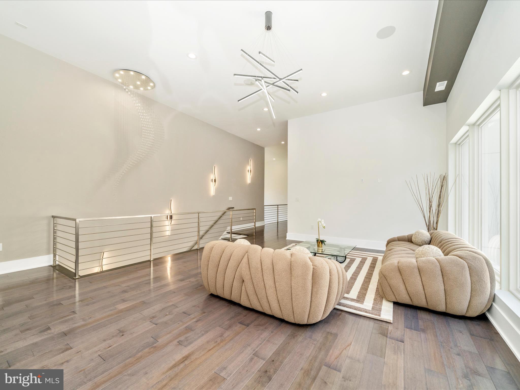 2209 Hunter Mill Road Vienna, VA 22181 - Photo 67 of 102 a living room with furniture and a wooden floor