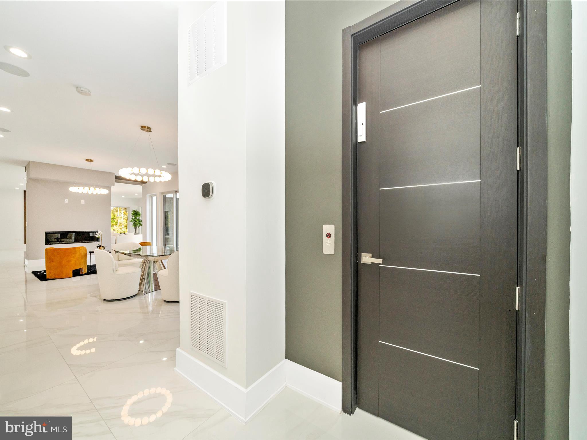 2209 Hunter Mill Road Vienna, VA 22181 - Photo 71 of 102 a view of a hallway with dining area and glass doors