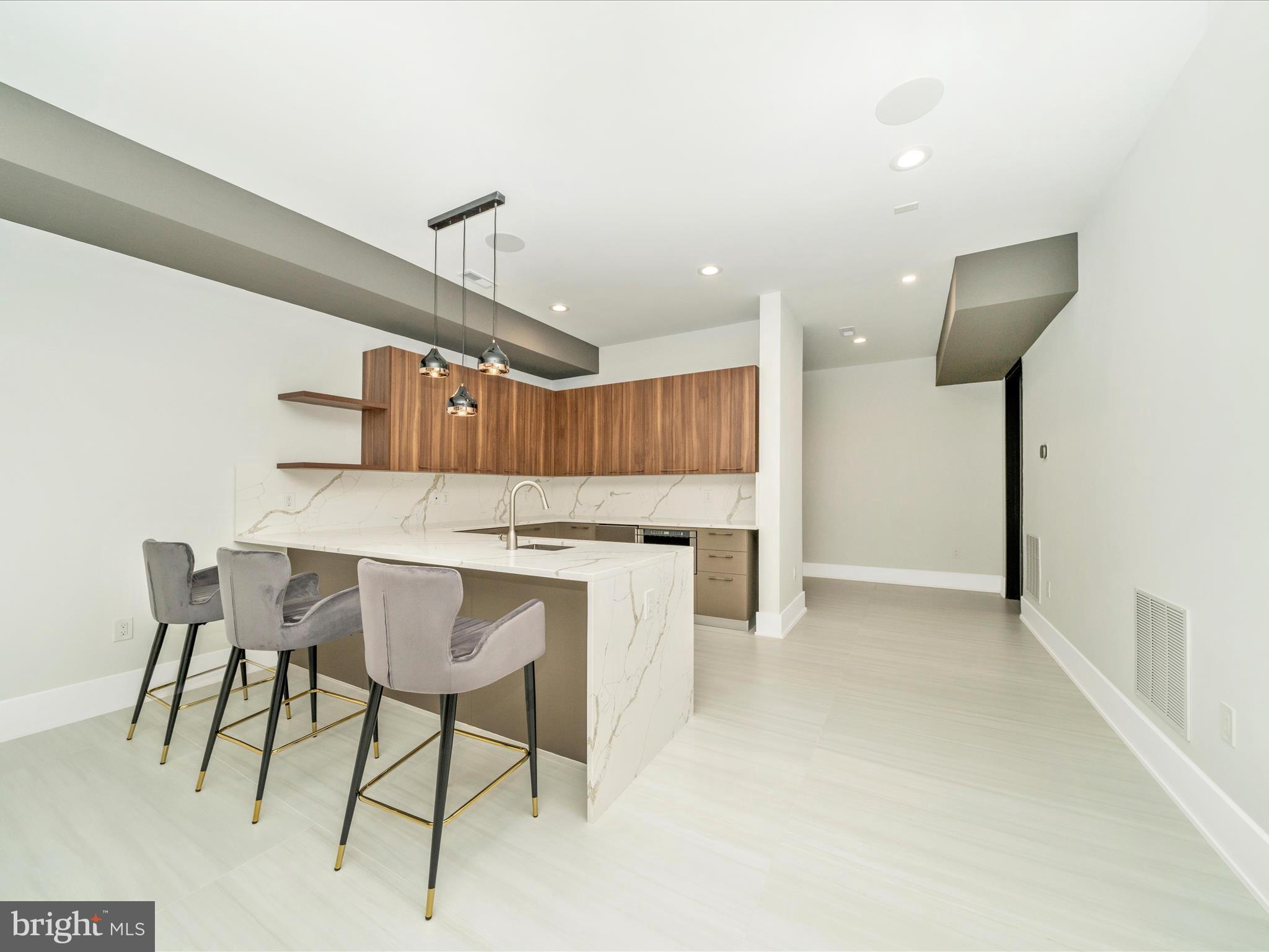 2209 Hunter Mill Road Vienna, VA 22181 - Photo 72 of 102 a kitchen with a table and chairs in it