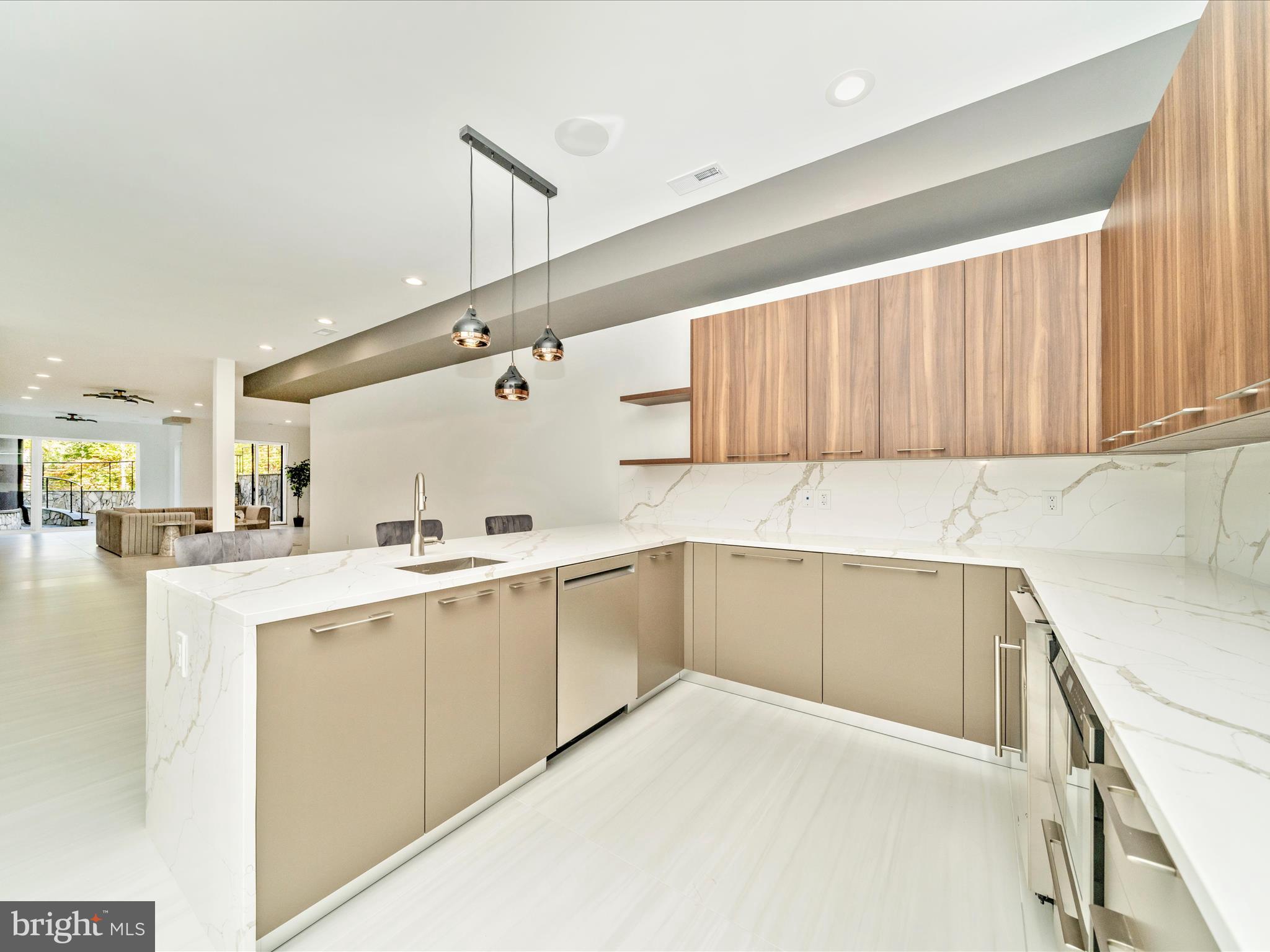 2209 Hunter Mill Road Vienna, VA 22181 - Photo 73 of 102 a kitchen with a sink cabinets and wooden floor