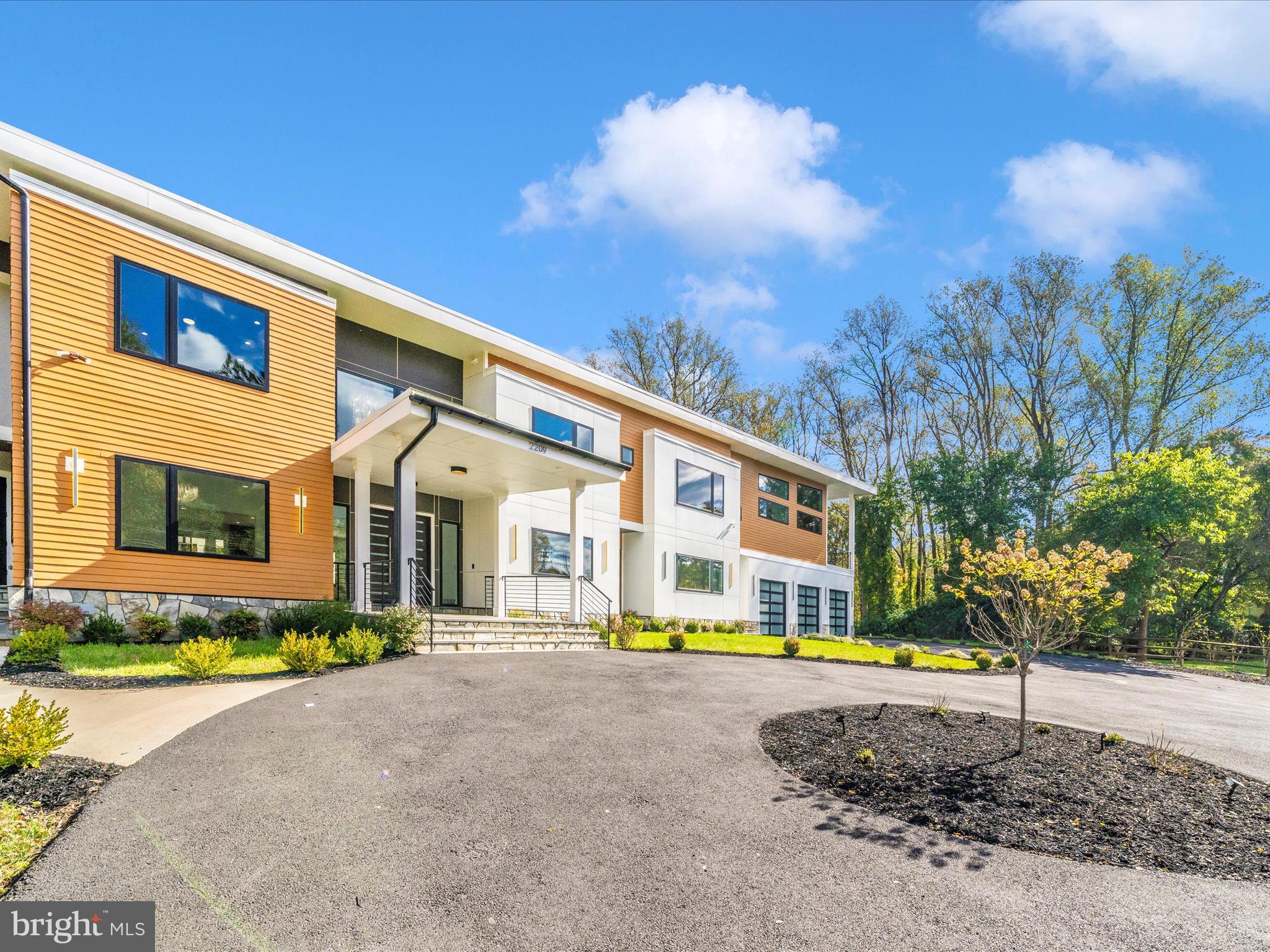 2209 Hunter Mill Road Vienna, VA 22181 - Photo 100 of 102 a front view of a house with a yard