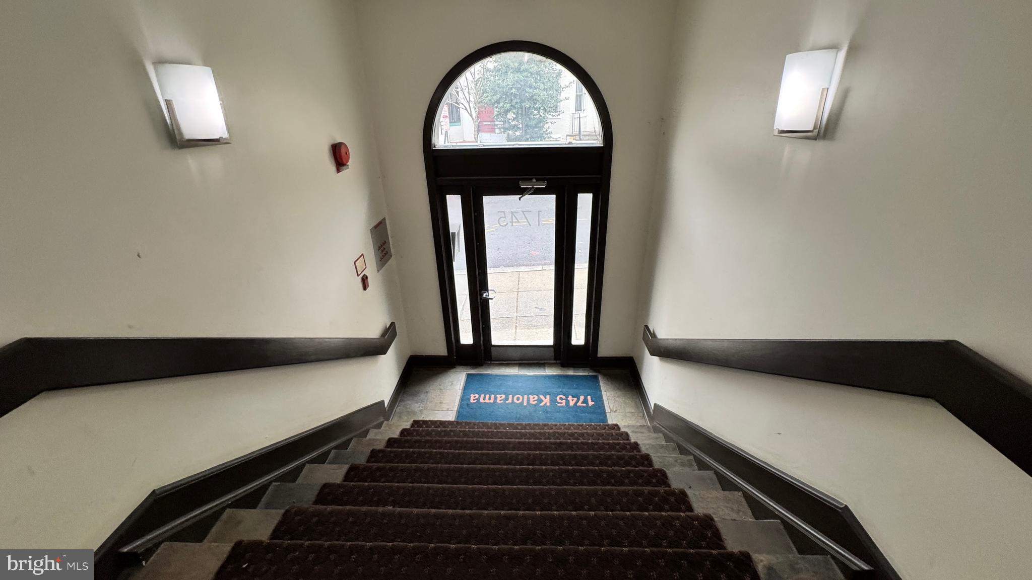 1745 Kalorama Road Northwest, Unit 101 Washington, DC 20009 - Photo 3 of 23 a hallway with a large window and wooden floor