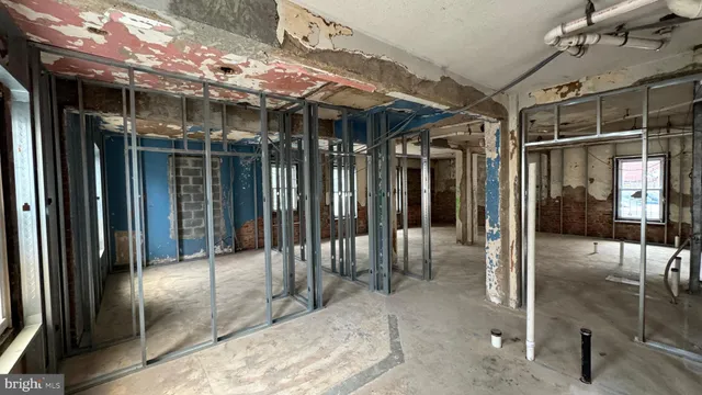 a view of an empty room with floor to ceiling window